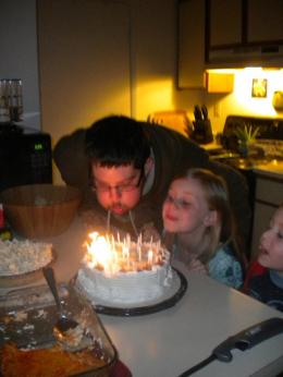 The day before, blowing out candles with our little Plesics.